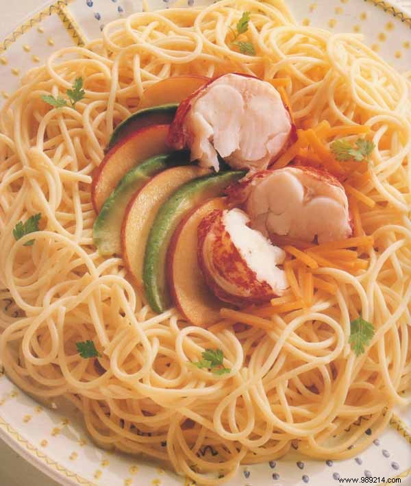 Fresh lobster salad with peaches and spagheti 