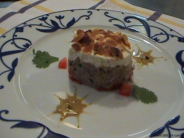 Nougat of duck legs with foie gras, candied tomatoes and Indian curry cream, Sichuan pepper 