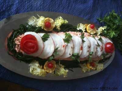 Hake stuffed en papillote cooked on the barbecue 