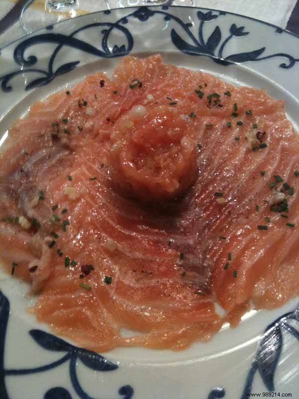 Raw salmon slices with lobster oil and ginger 