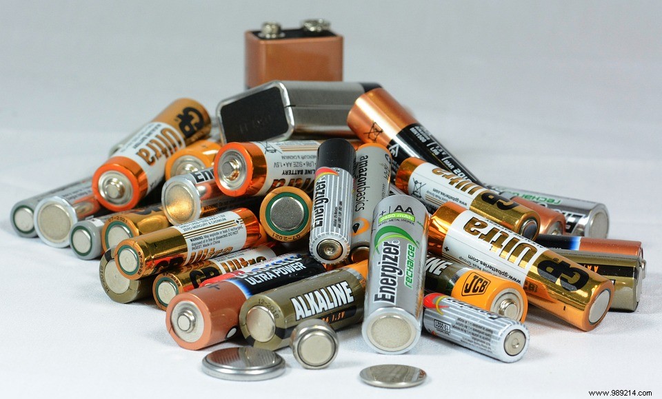 Why should you avoid throwing your batteries in the trash? 
