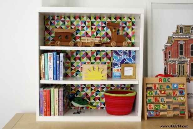 How to decoupage paper on the back of a shelf