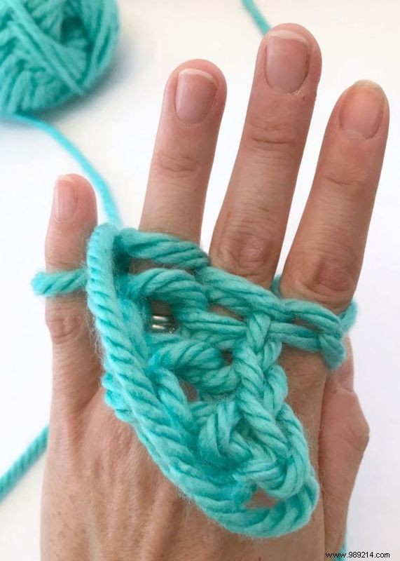 No knitting needles are required to make this hand knit necklace